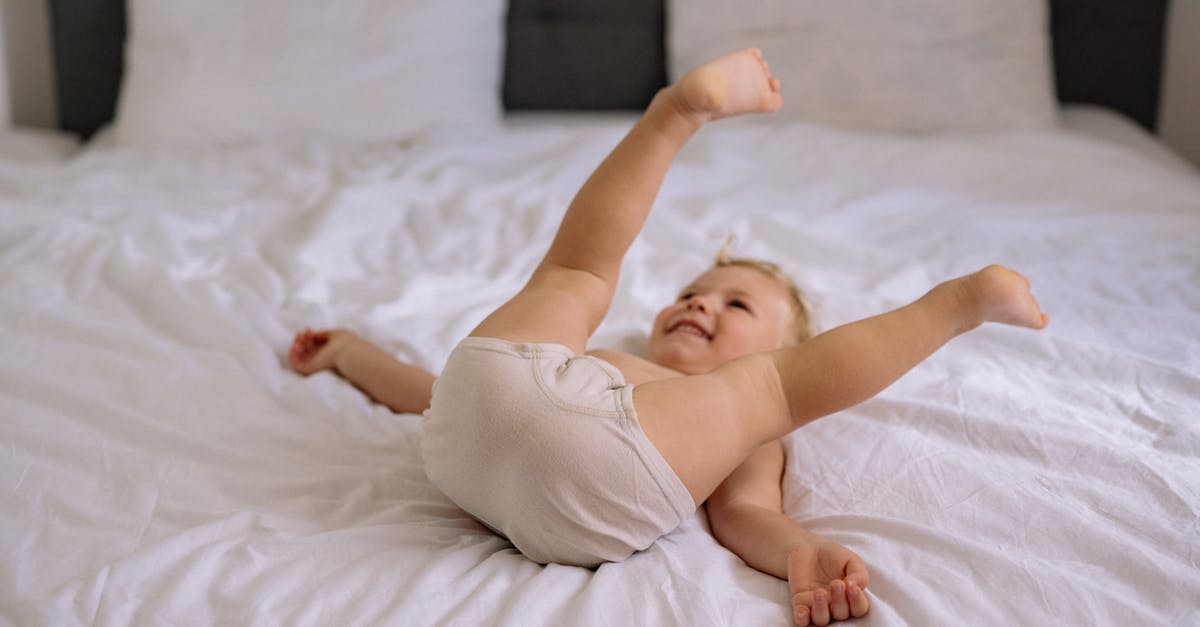 Does proofing time depend on the quantity of dough? - Baby in White Tank Top Lying on White Bed