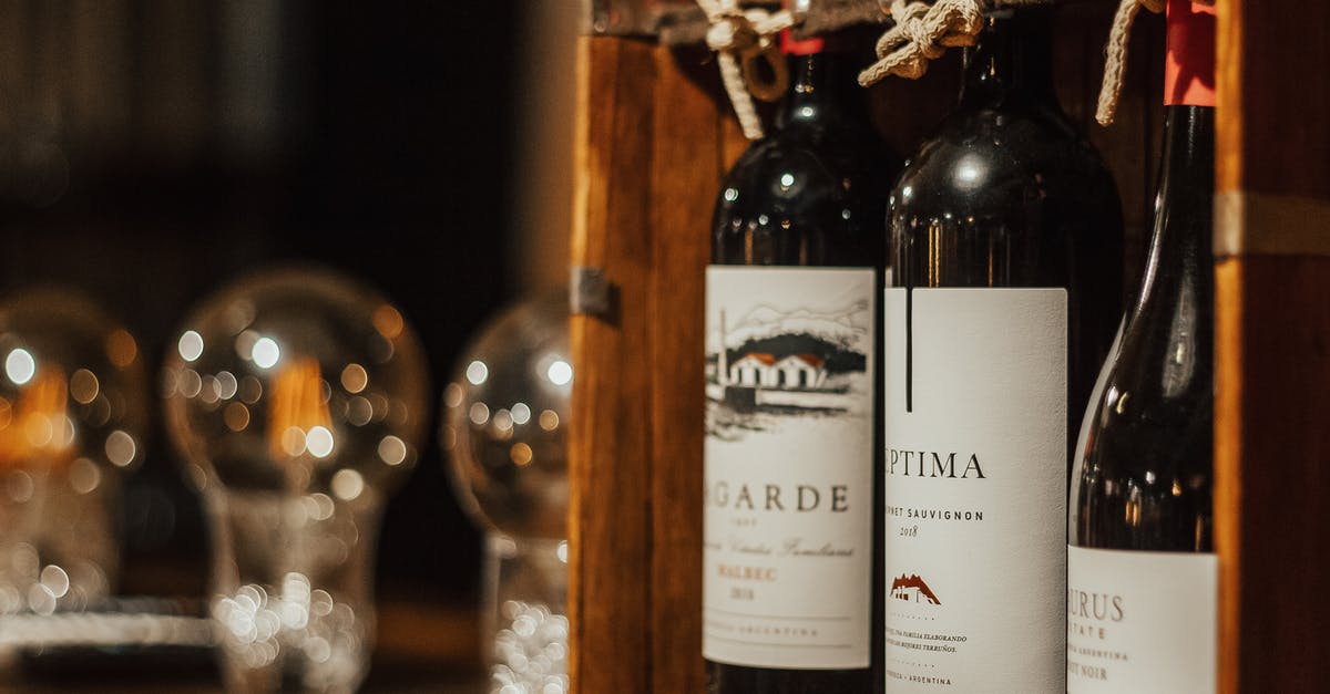 Does quality decrease by heavily reducing wine? - Bottles of wine in wooden box arranged on table