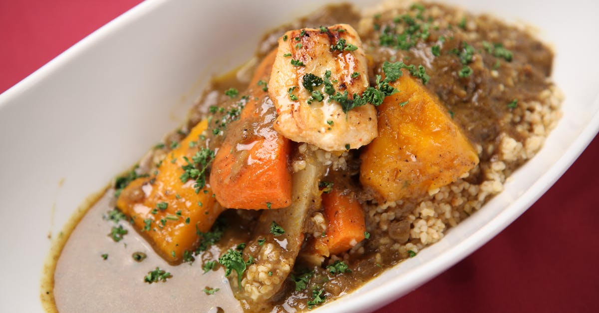 Does resting stew lead to more succulent meat? - Close-up Photo of Meat Stew on White Ceramic Bowl