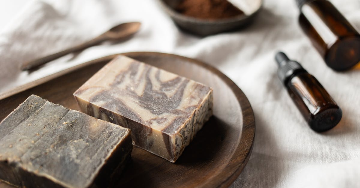 Does Simmering peppers in oil bring out more flavor? - Handmade brown soap on timber board near aromatic oil