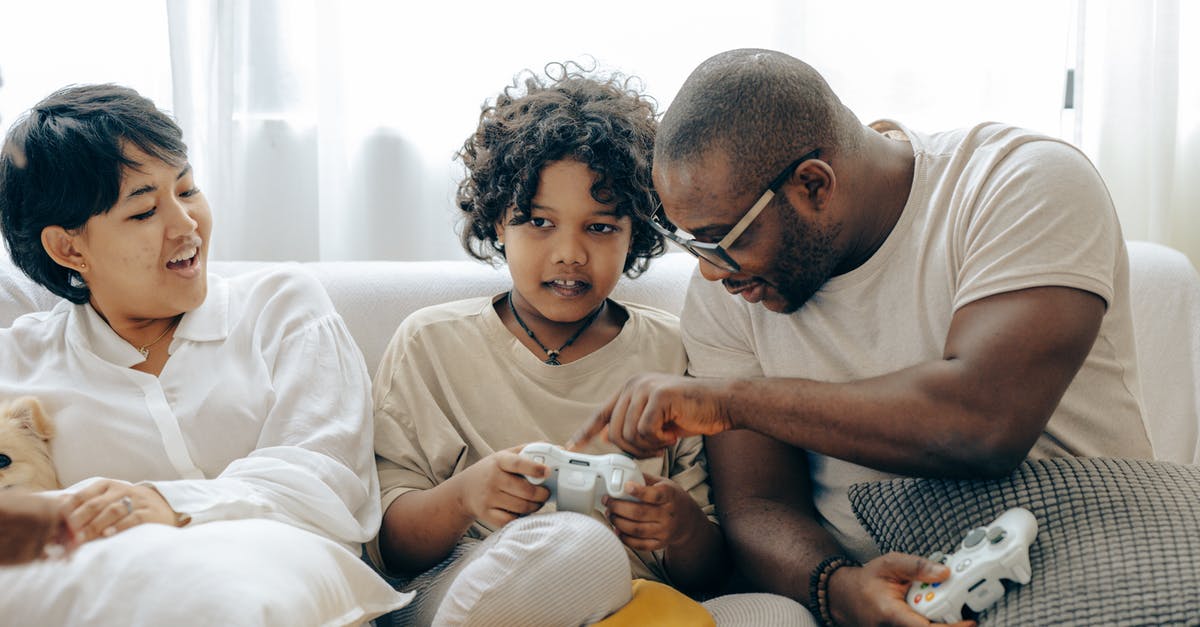 Does smoke point affect max temp of patina - Concentrated black father pointing on joystick buttons explaining rules of playing to son while positive mother watching process