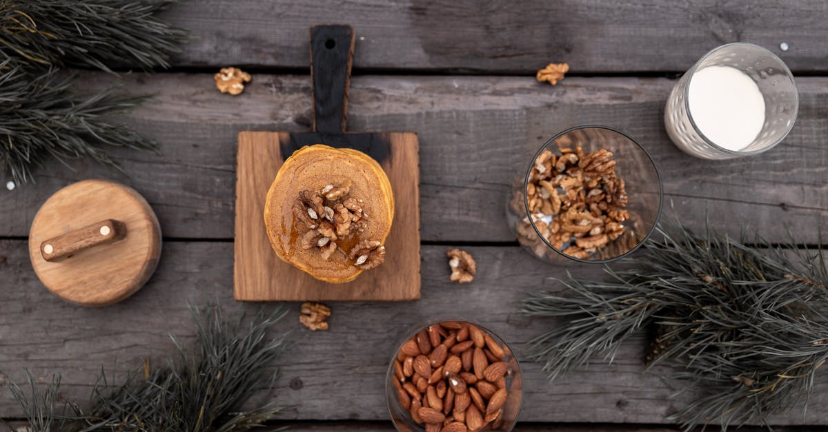 Does soaking almonds have the same effect as blanching and removing the skins when making almond milk? - Brown Wooden Chopping Board With Stack of Pancakes