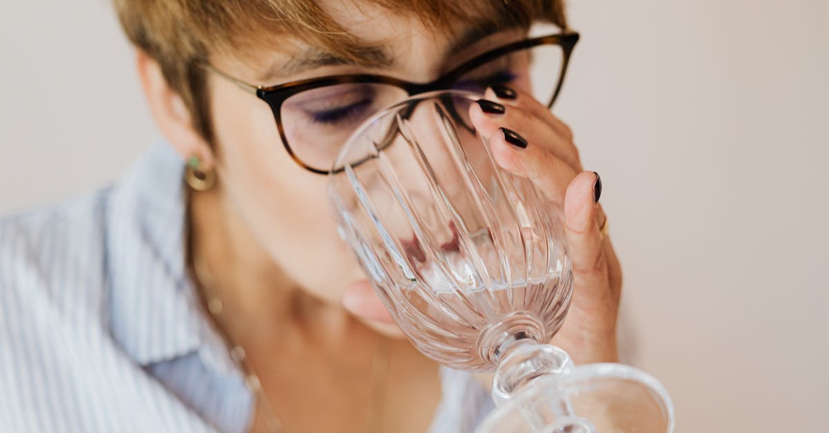 Does soaking liver in water instead of milk work well? - Crop woman with eyewear drinking water