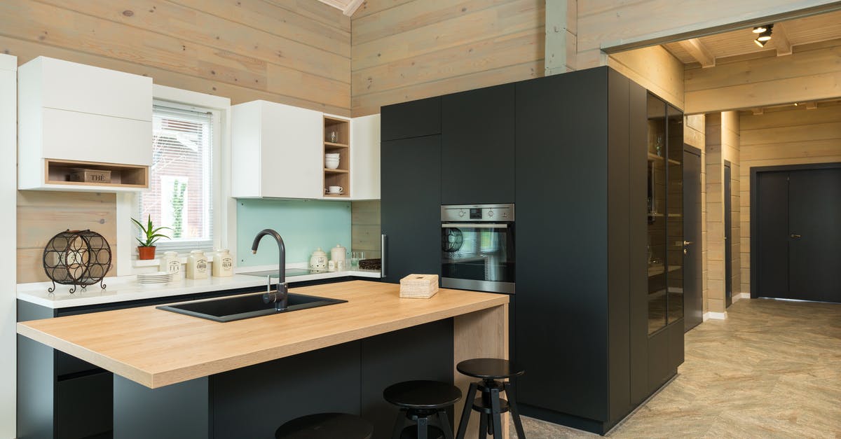 Does the oven door need to be toughened glass? - Minimalist style of kitchen with bar chairs at counter and matte cupboards in spacious private house