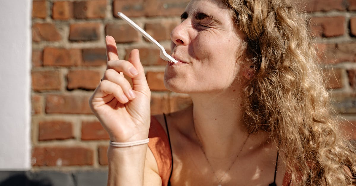 Does the PH in your mouth affect taste? - Woman Holding Fork with Her Mouth 