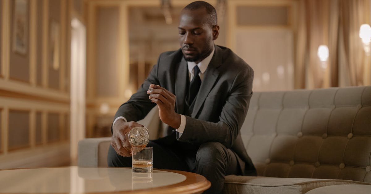 Does whiskey go bad by freezing? - Man Pouring Whiskey on His Glass