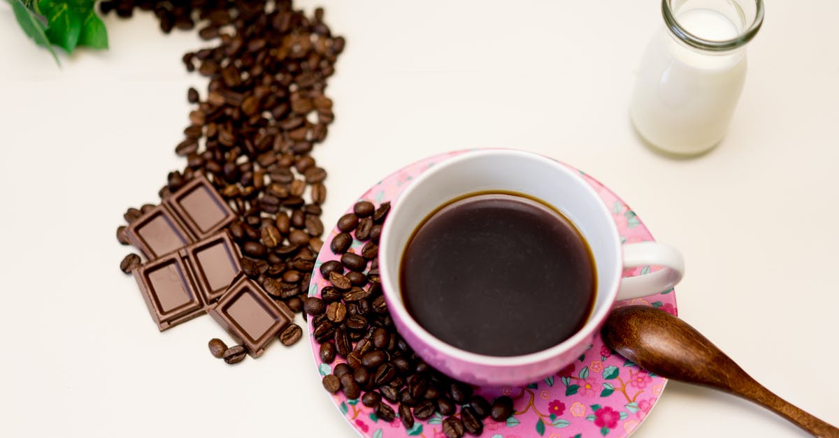 Does white chocolate HAVE to have milk in it? - A Cup of Black Coffee Beside Roasted Coffee Bean and a Glass of Milk