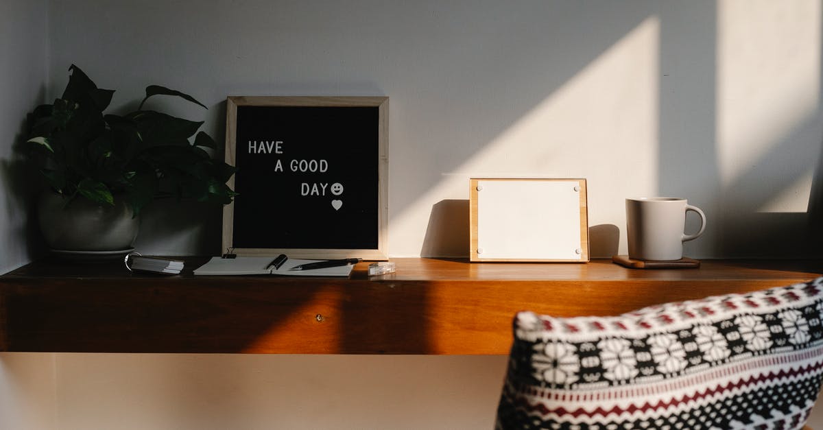 does white sugar have a shelf life? - Chair with cushion placed at wooden shelf with Have A Good Day inscription on black board between potted plant and blank notice board with paper