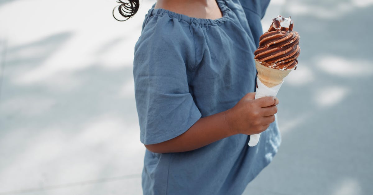 don't like sweet food except for dessert - Asian girl in cotton T shirt with ice cream cone