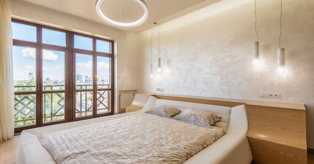 double boiler (temp?) - Trendy light bedroom with balcony