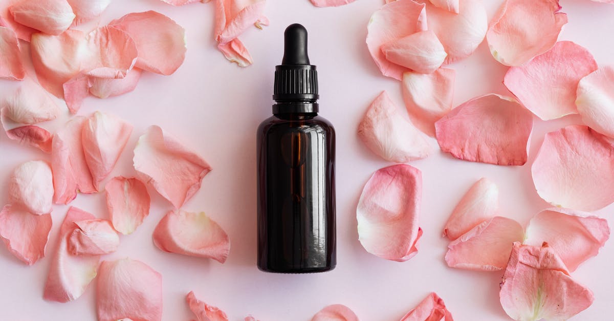 Dried tomatoes vs. dried tomatoes in oil - Set of pink petals and bottle on table