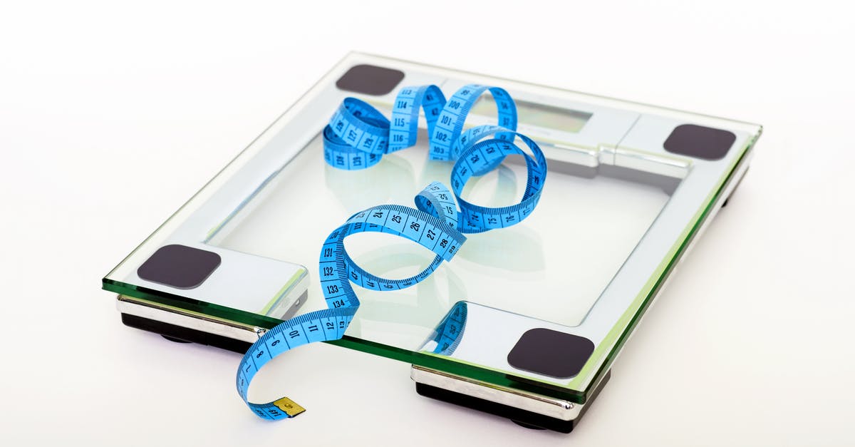 Dry measurement and conversion to weight - Blue Tape Measuring on Clear Glass Square Weighing Scale