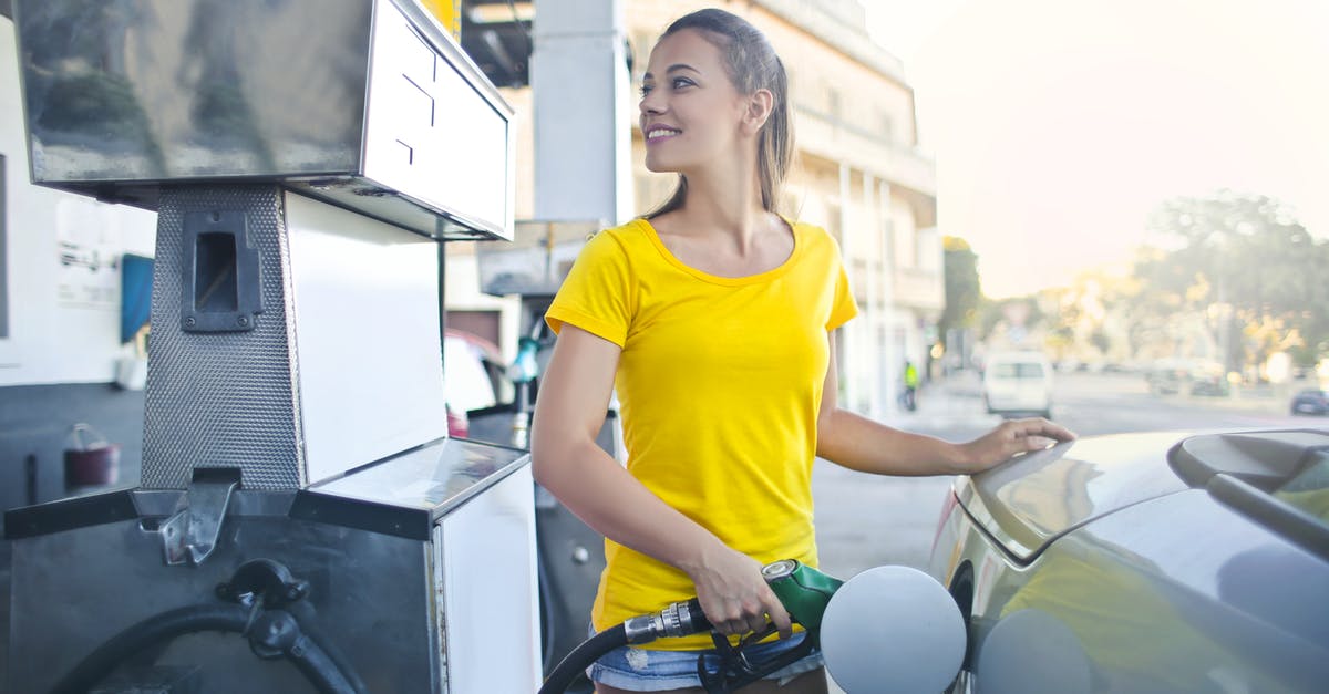 Dulce De leche as a macaron filling - Woman in Yellow Shirt While Filling Up Her Car With Gasoline