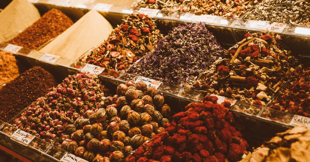 Dutch savoury spices and herbs - Containers Full of Spices on a Market Stall 