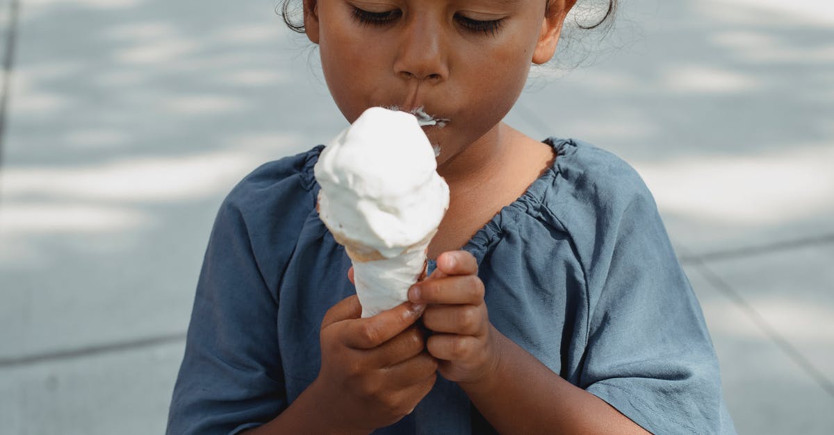 Earthy tasting frozen salmon - Asian girl eating ice cream on street