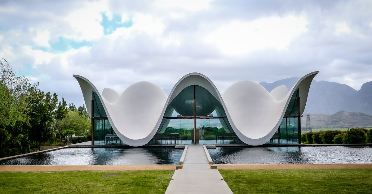 Easiest way to peel pomelos? - A Modern Building Near the Body of Water Under the Cloudy Sky