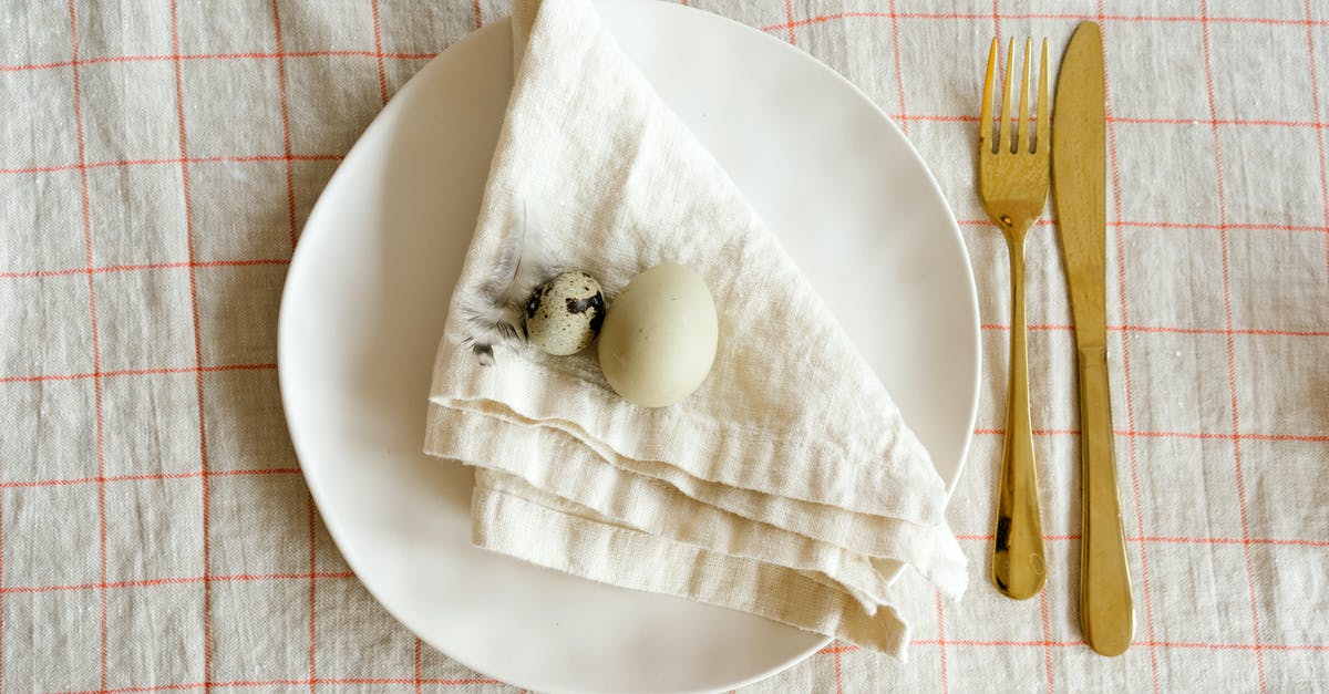 Egg of a dove in my flowerpot - Eggs and Kitchen Table on White Ceramic Plate