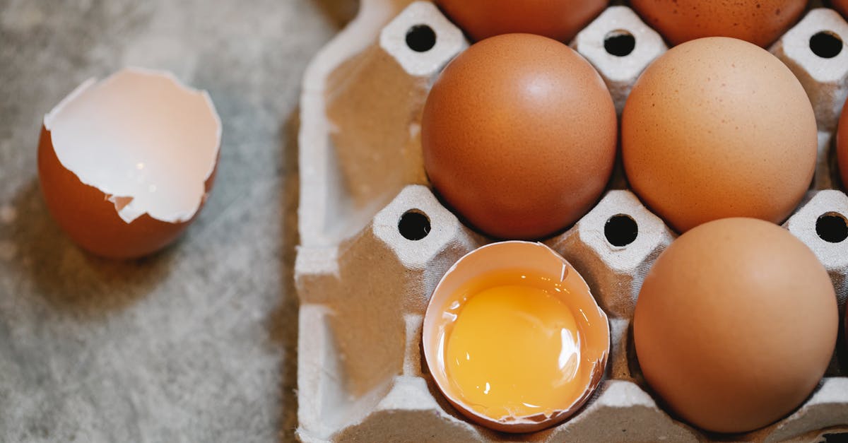 Egg yolk substitute for whole eggs in strata - Broken egg in row with in carton box