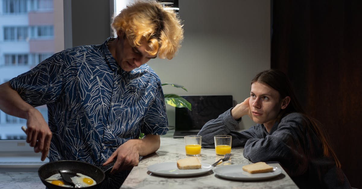 Eggs sticking to the pan - A Couple Having Breakfast