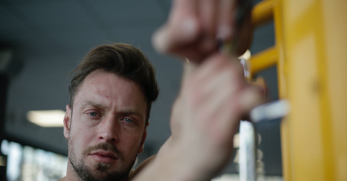 Energy bar is too soft - Confident strong adult sportsman in gym during workout