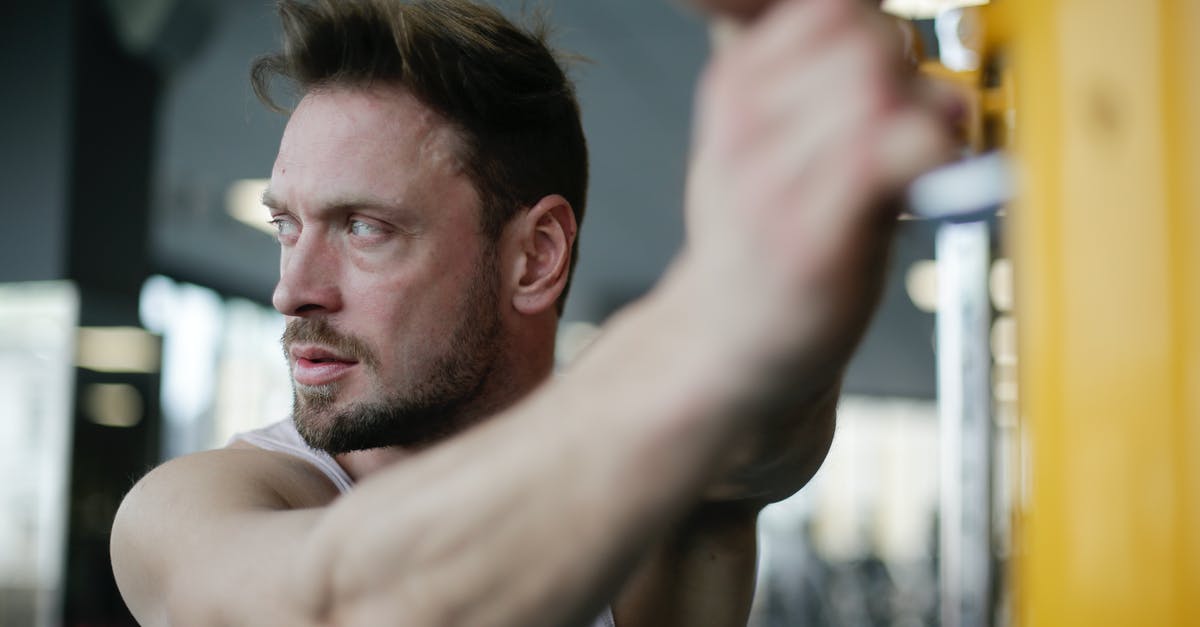 Energy bar is too soft - Confident strong adult sportsman during workout in gym