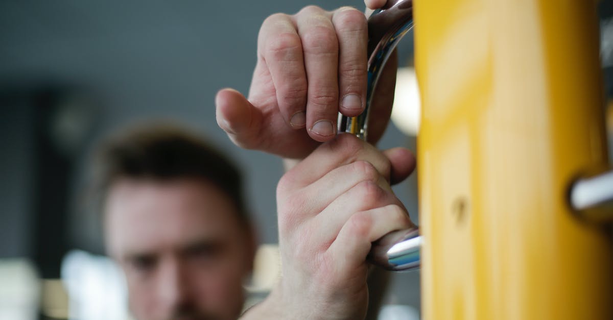 Energy bar is too soft - Unrecognizable adult sportsman in gym during workout