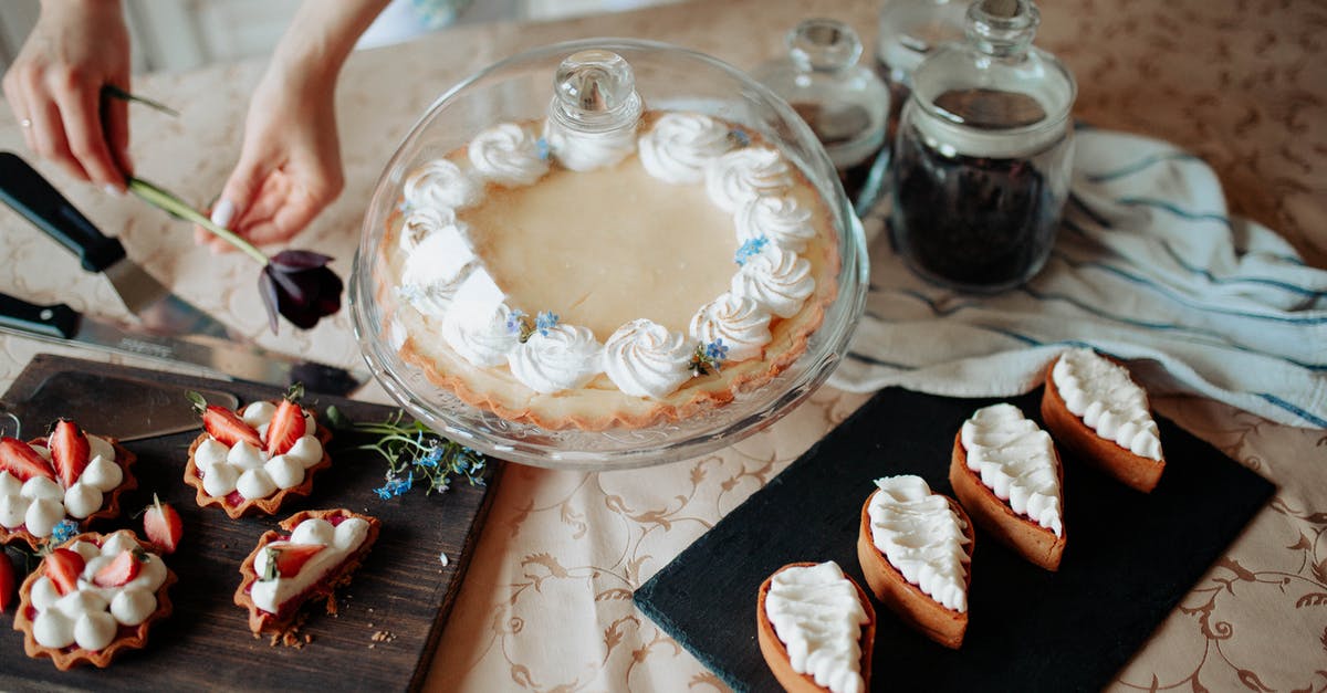 Enlarging from a home bakery to a commercial bakery - Crop woman with various delicious cakes