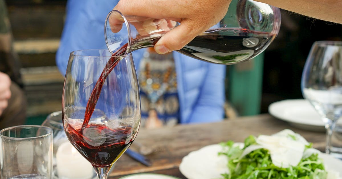 Exact food category of a food item - Person Pouring Red Wine on Wine Glass