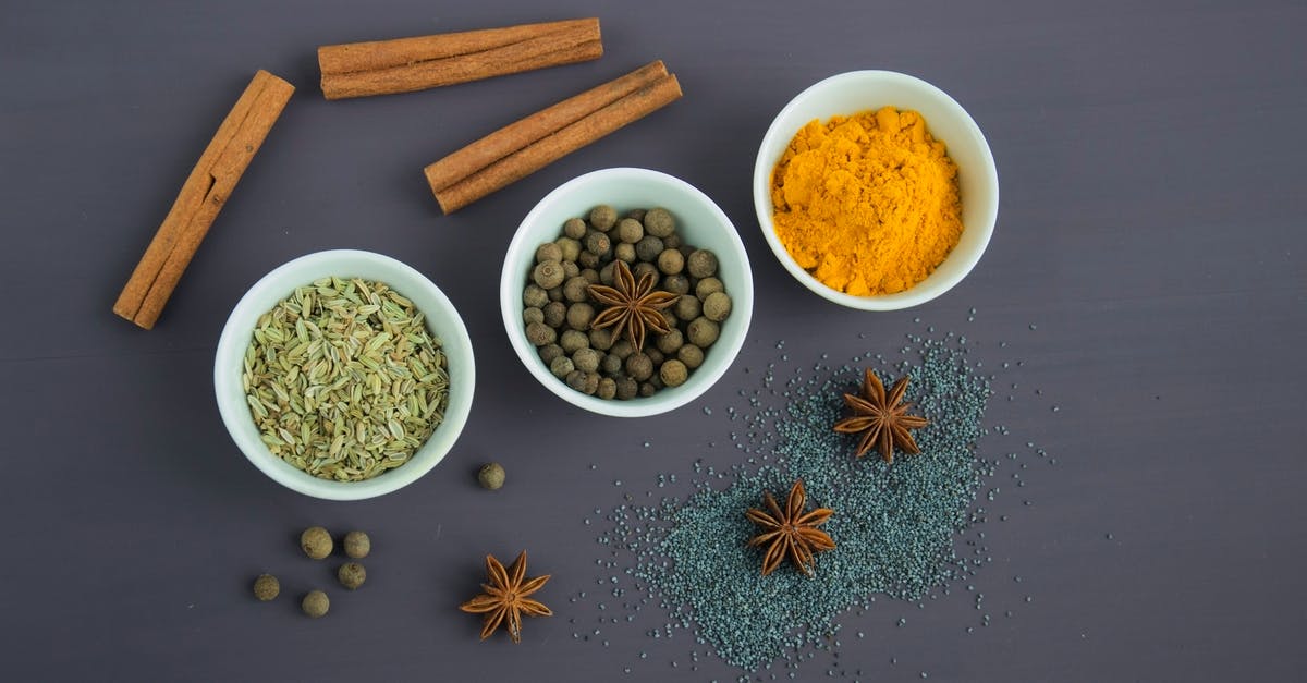 Excess coriander in mutton curry - Assorted Spices Near White Ceramic Bowls