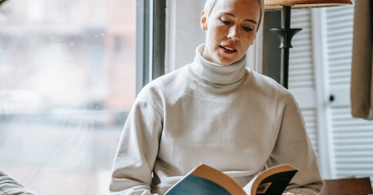 Fermentation: volume vs. time - Woman reading interesting book near window