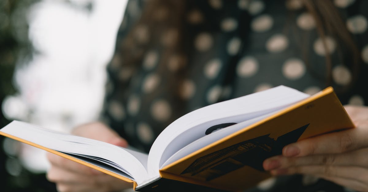 Fermentation: volume vs. time - Crop faceless woman reading novel at home