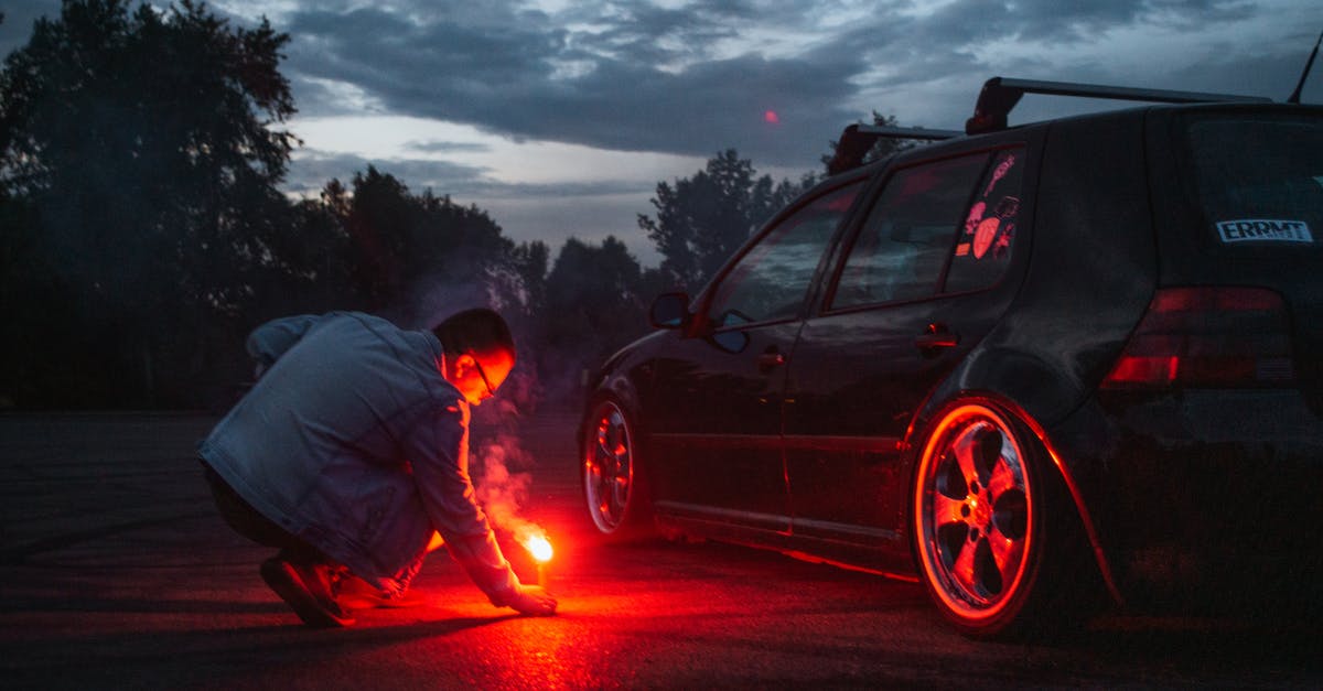 Fermenting by accident - Man in Gray Jacket Standing Beside Black Car during Night Time