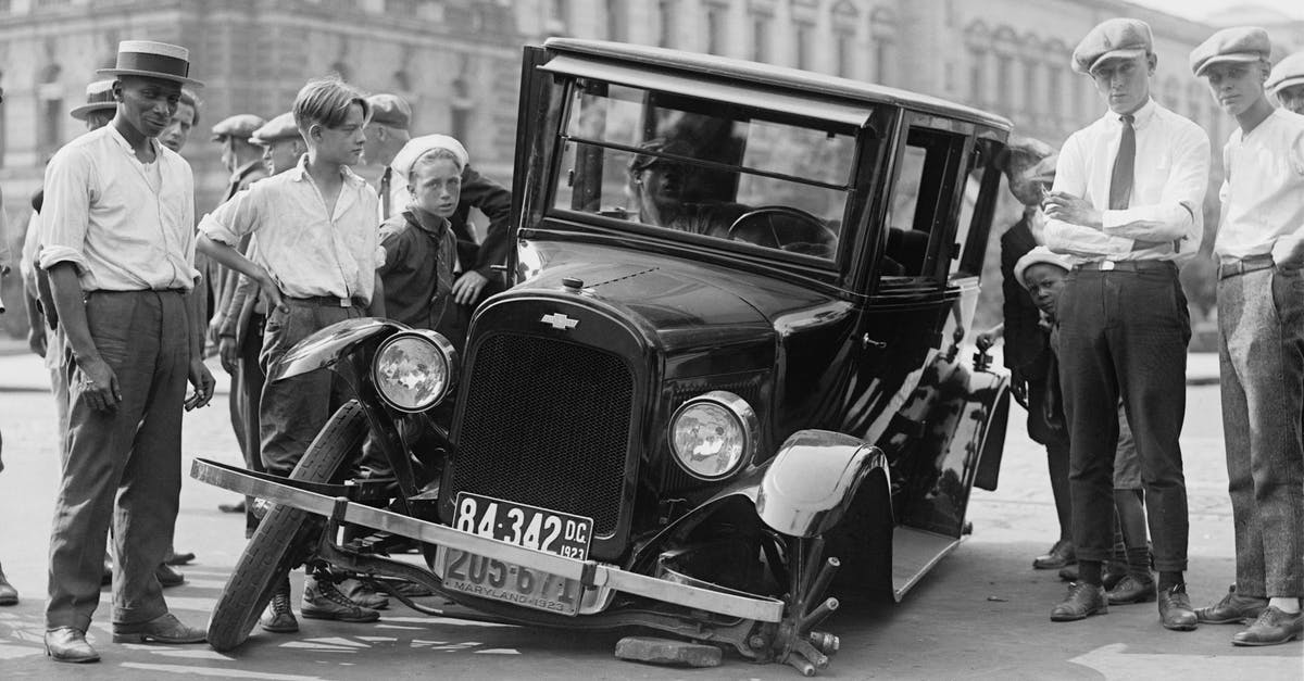 Fermenting by accident - Grayscale Photo of People Standing near the Wrecked Vintage Car