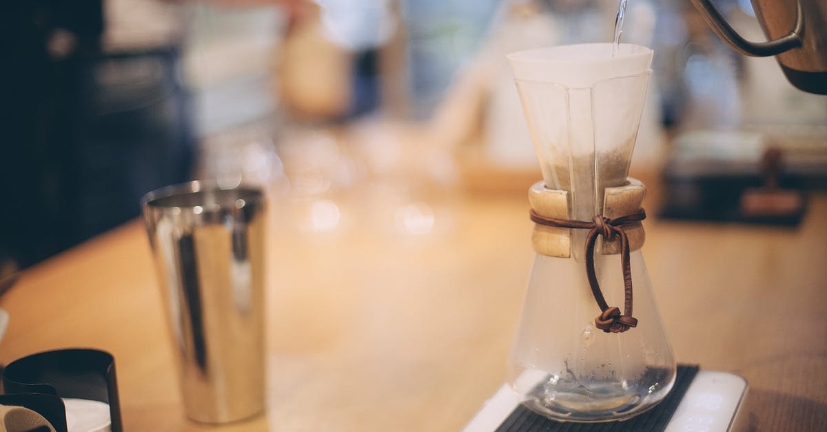 Filling a hot Kettle - Barista brewing coffee using chemex method