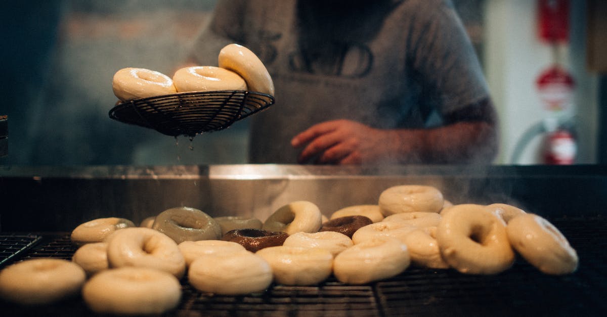 Finding the right cooking classes? - Man in Gray Long Sleeve Shirt Standing Near Donuts