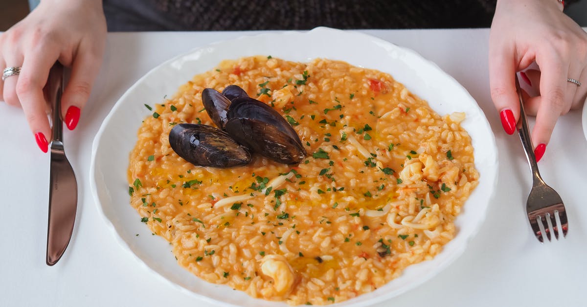 Firm risotto using generic rice. Is it possible? - A Delicious Rice Meal with Clams on White Plate