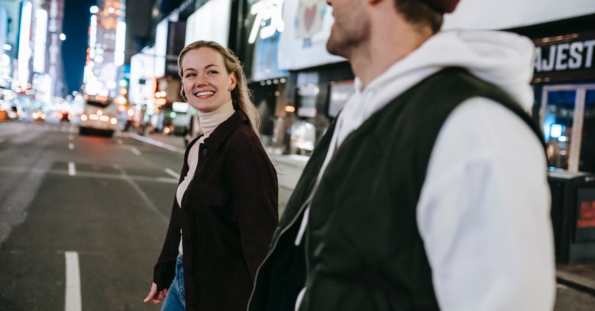 First slicing, then cooking, or the other way around? - Positive couple walking on road