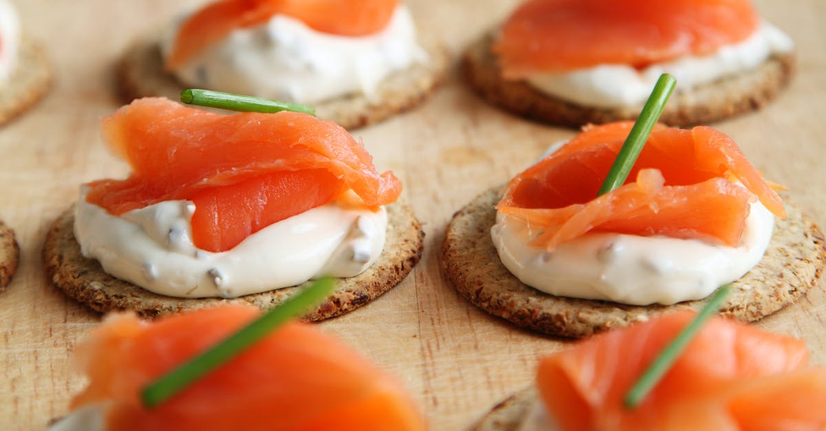 Fish and cheese: An unbreakable rule? - Brown White and Orange Round Food on Table Top