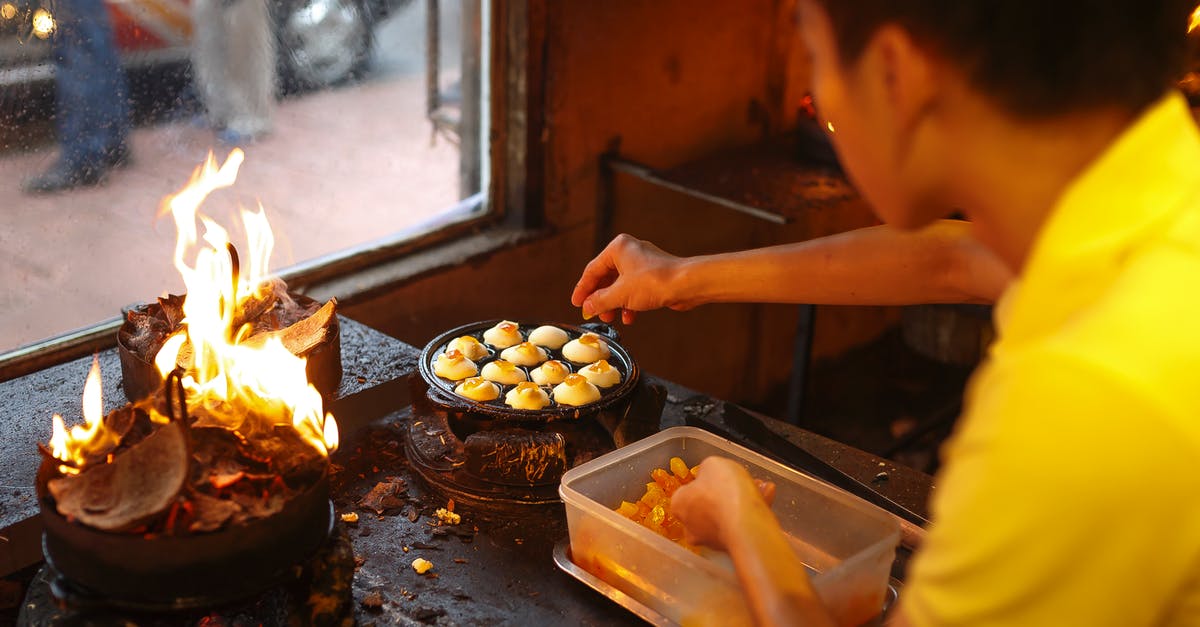 Flames into cooking area - Man Cooking Inside Kitchen