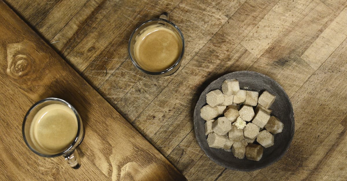 Flavour espresso with vanilla without adding sugar or other sweetener? - Close-Up Shot of Cups of Coffee beside Sugar