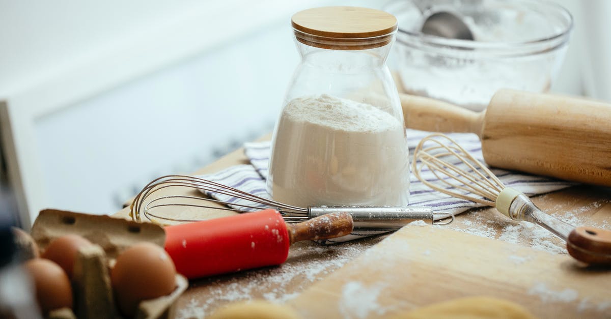 Flour is many years expired but still looks good - Ingredients and kitchenware on table in daylight