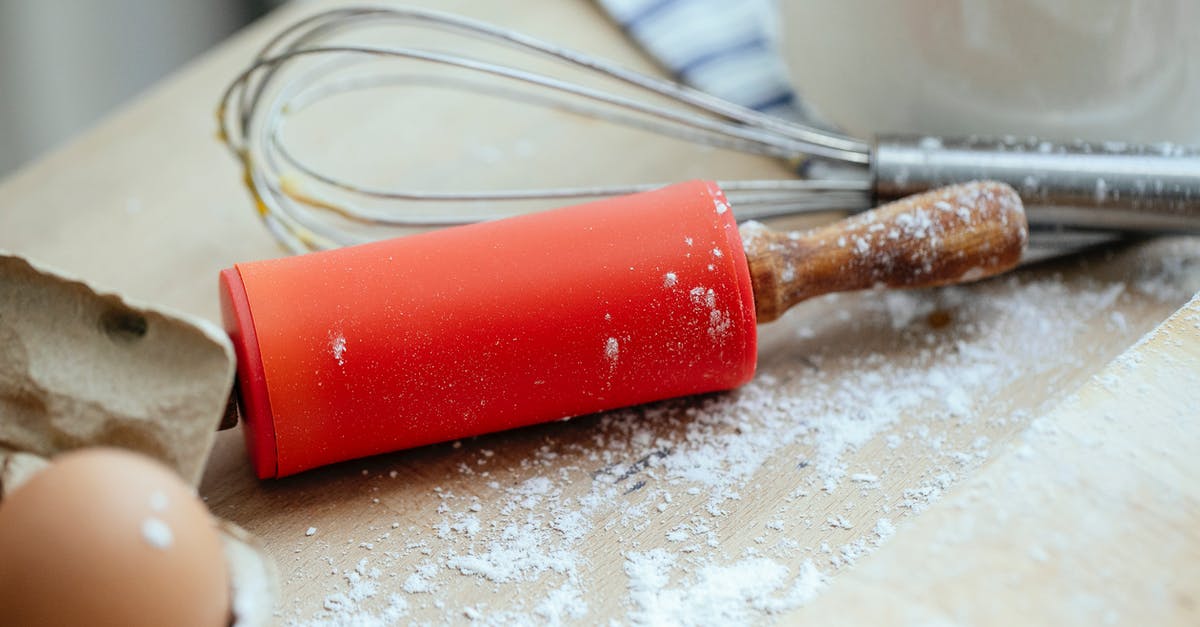 Flour is many years expired but still looks good - Wooden table with rolling pin and whisk and eggs near chopping board covered with flour in kitchen