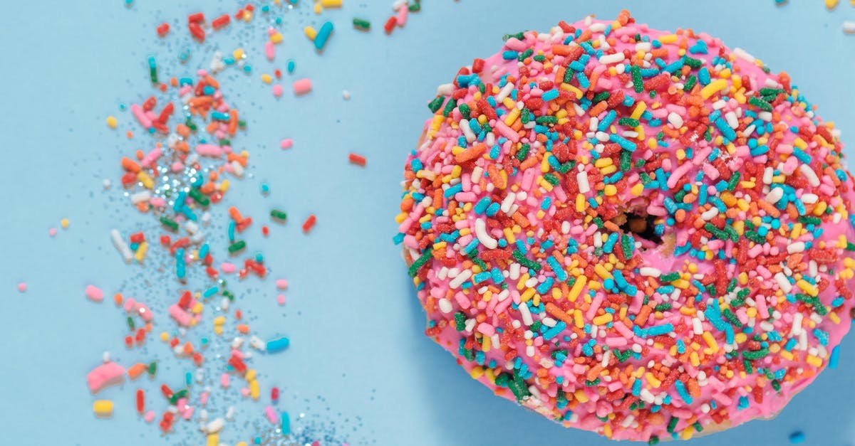 Flourless cake didn't set - Colorful donut with sprinkles on blue surface