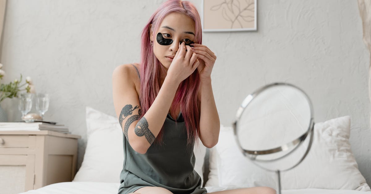 Flourless cookies form "skin" that seals in moisture - Woman with Pink Hair Applying Eye Patches