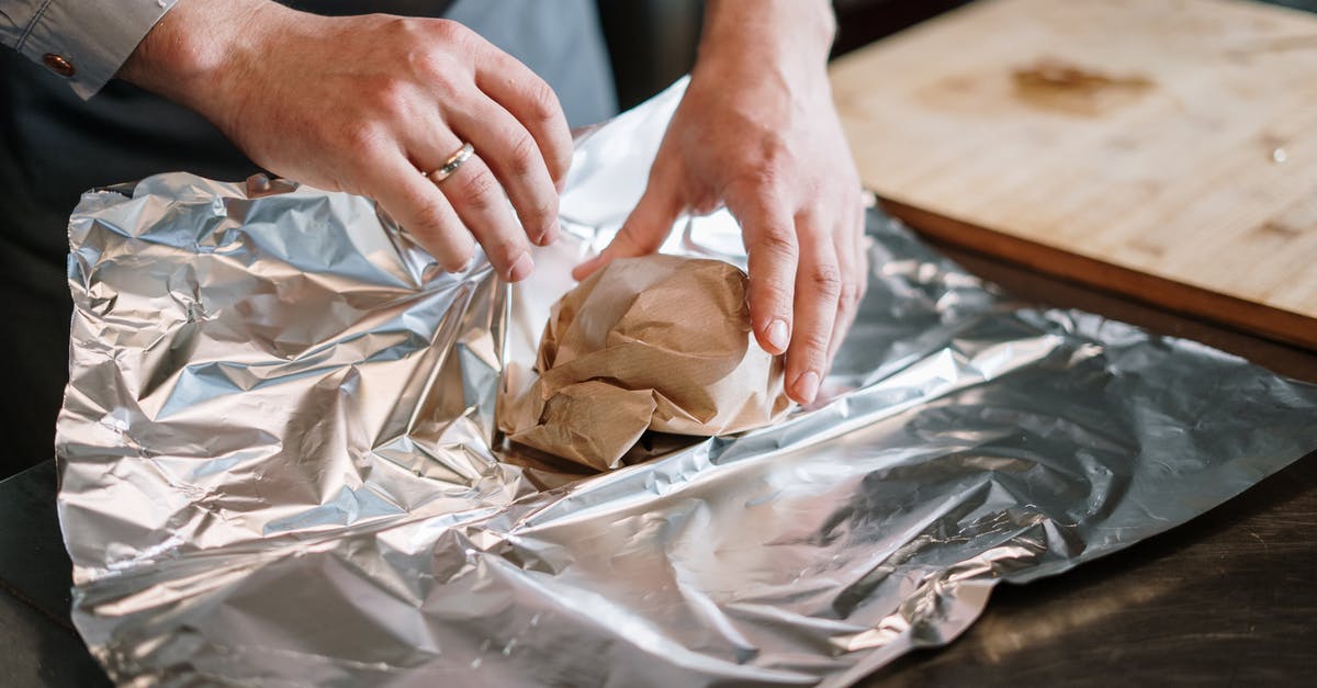 Foil Wrapping BBQ Ribs in Convection? - Person in White Long Sleeve Shirt Holding Brown Bread