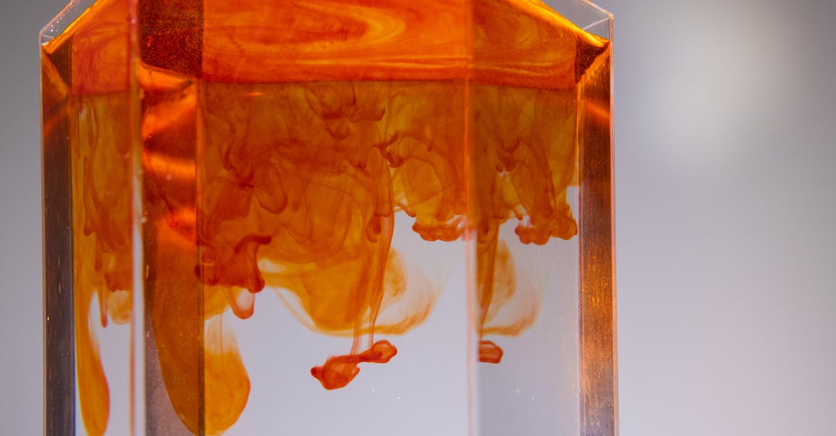 Food dye to simulate stained glass - Glass with colorful ink flows in liquid