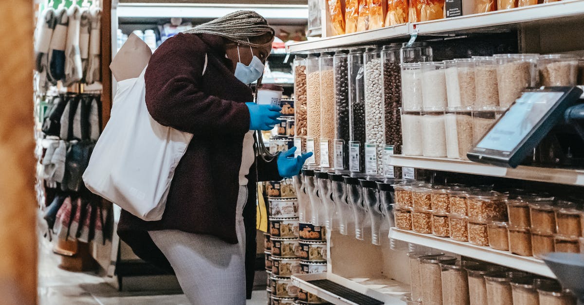 Food safe airbrushing - Black woman choosing grains in supermarket