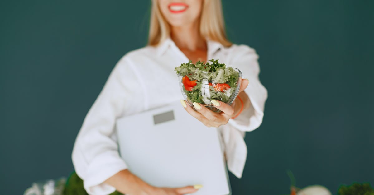 Food that does not spoil, lightweight, energetic and balanced - Woman Holding a Bowl with Salad and Smiling 