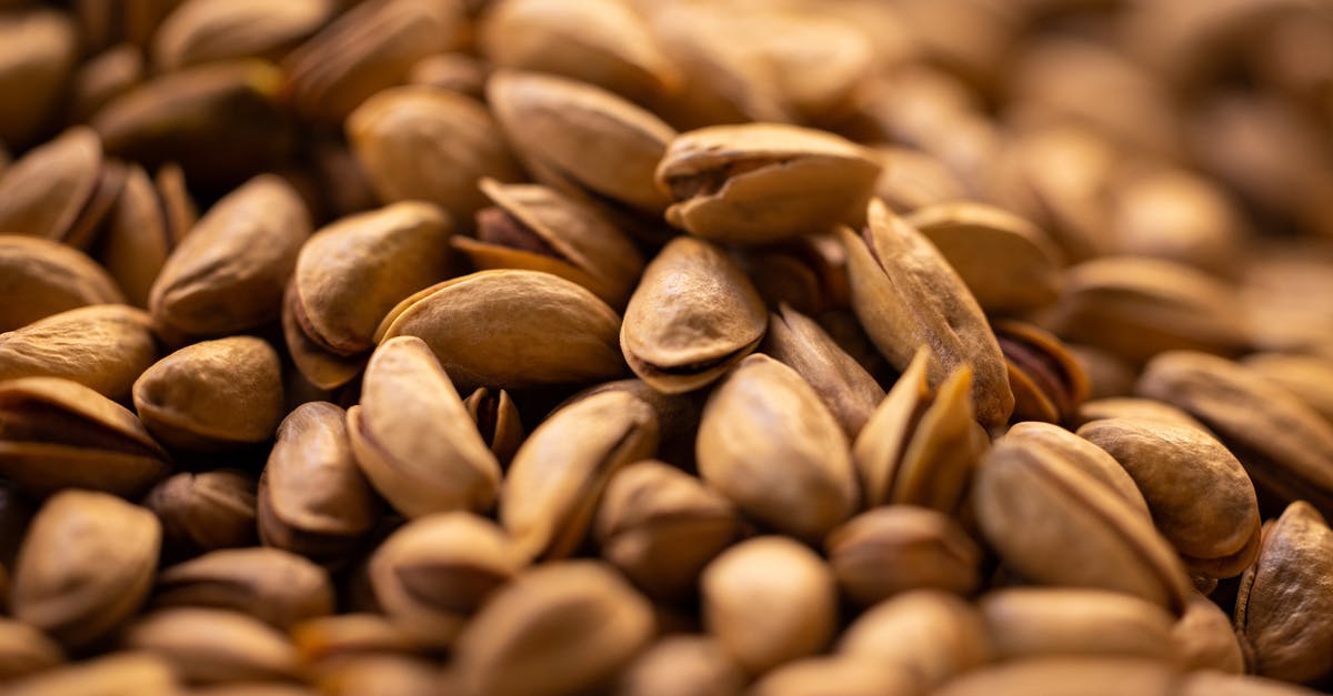 For peanut butter, do peanuts have to be roasted with their shells or without their shells? - Pistachio Nuts with Shells in Close Up Photography