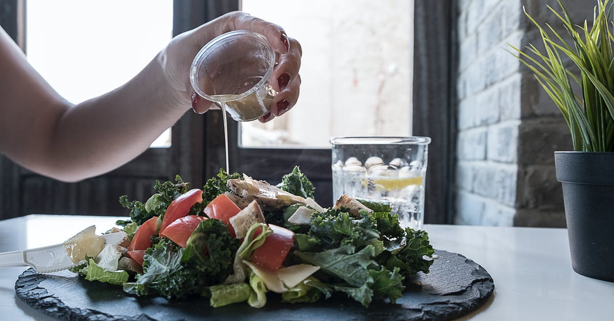 For salad dressings, replacing mustard with lecithin as an emulsifier? - Person Pouring Dip on Vegetable Salad